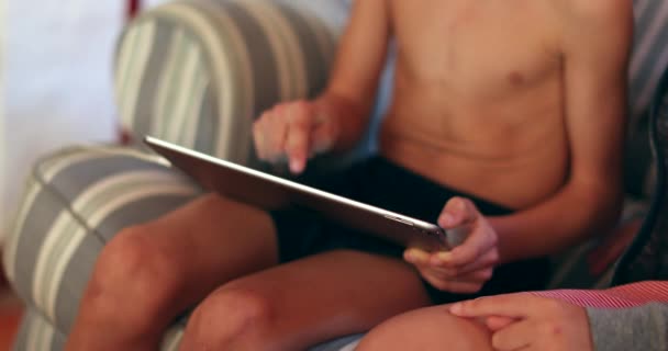 Child Holding Large Tablet Playing Game — Vídeos de Stock