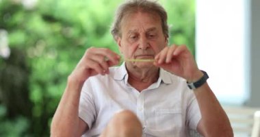 Pensive older man thinking. Senior thoughtful retired person