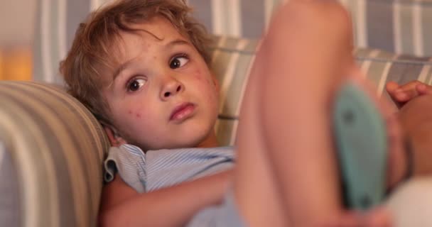 Child Toddler Boy Staring Screen Sofa Night — Stock videók