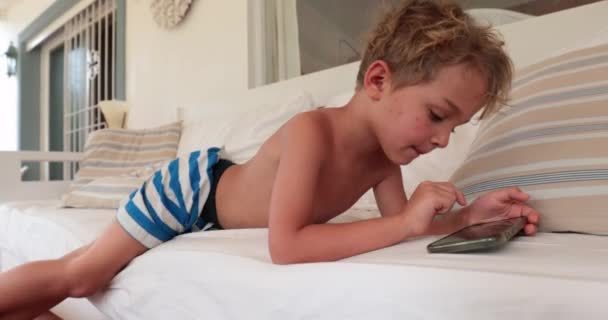 Casual Little Boy Child Using Cellphone Lying Sofa — 비디오
