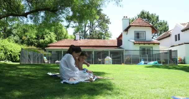 Mother Helping Child Study Teaching Read Home Backyard Lawn — Stok video