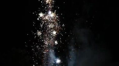 Fireworks celebration bursting in slow-motion in the dark