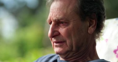 Pensive older man feeling ill. Senior man face feeling sick