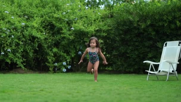 Joyful Small Girl Running Jumping Outdoors — Stock Video