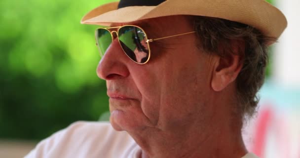 Cool Senior Man Wearing Sunglasses Hat Relaxing Outdoors Pensive Retired — Video Stock