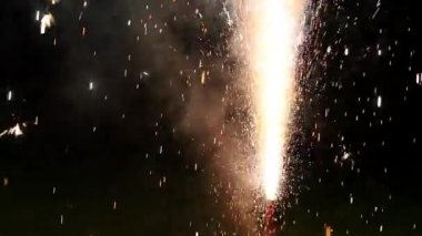 Sparks firework celebration at night glowing in slow-motion