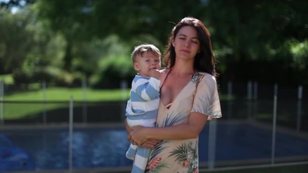 Mother Her 30S Holding Infant Baby Son Outdoors Home Backyard — Stockvideo