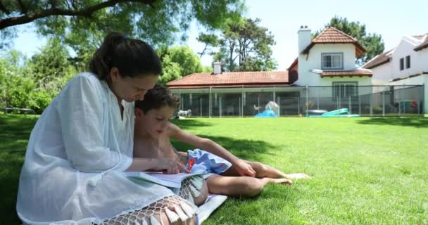 Mother Helping Child Study Teaching Read Home Backyard Lawn — Wideo stockowe