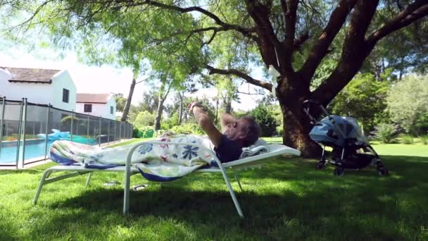 Retired Man Checking Time While Lying Nature — Stock video