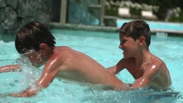Children Competing Swimming Pool Game Brothers Fighting Ball — Stock Video