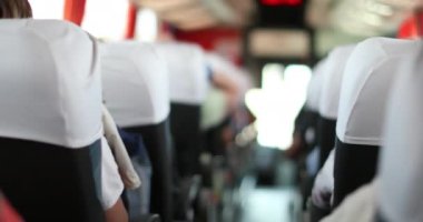 Bus interior traveling on road, passenger point of view, shuttle perspective