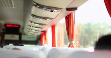 Back of bus perspective traveling on road