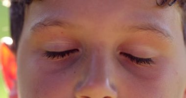 Meditative child eyes closing for calmness and meditation