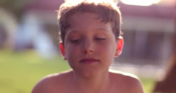 Cute Child Boy Sitting Outdoors Sunlight Garden Portrait Face — Stok video