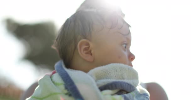 Infant Toddler Wrapped Towel Pool Held Parent Sunlight Lens Flare — Stock Video