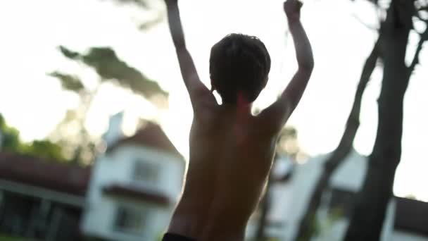 Excited Happy Child Raising Arm Air Celebration Kid Outdoors Sunset — стоковое видео