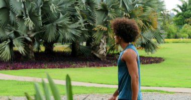 African black man walking in nature smiling and laughing