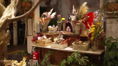 Interior of Flower Shop with decoration. Small business store studio. Decorations arrangements and gifts. Service and sale of home plants