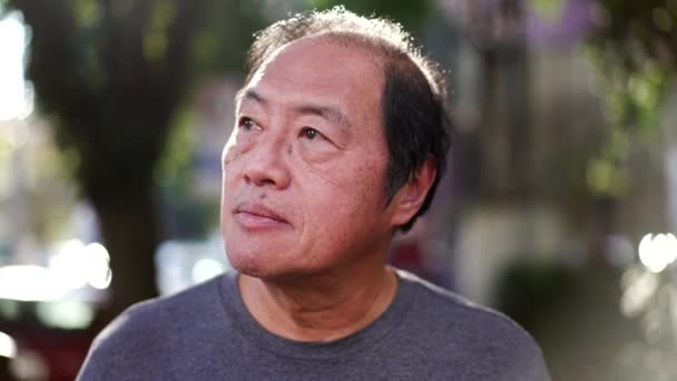 Contemplative Middle Aged Asian Man Walking Sunlight Being Mindful Portrait — Stok Video