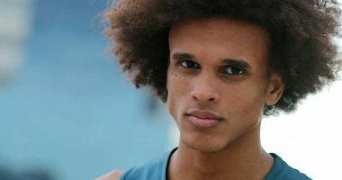 Mixed race handsome young man with serious expression