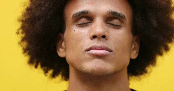 Meditative African Young Man Closing Eyes Yellow Background — Stockfoto