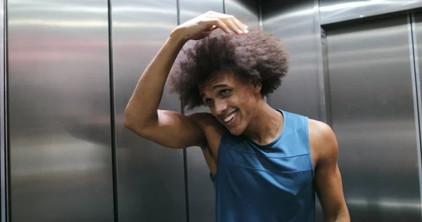 Young African Man Playing Hair Front Elevator Mirror Door Opening — Stock Fotó
