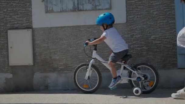 Child Riding Bicycle Urban Street Little Boy Rides Bike Sidewalk — Stock Video