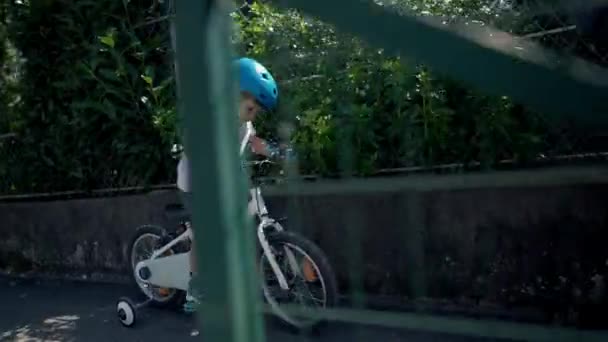 Child Riding Bicycle Street Kid Rides Bike Sidewalk — Stock Video