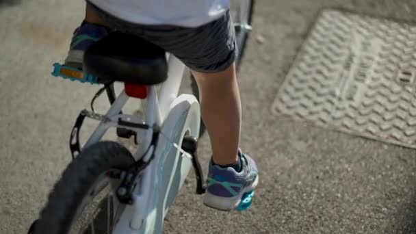 Child Legs Riding Bicycle Close Feet Shoes Rides Bike — Stock Video