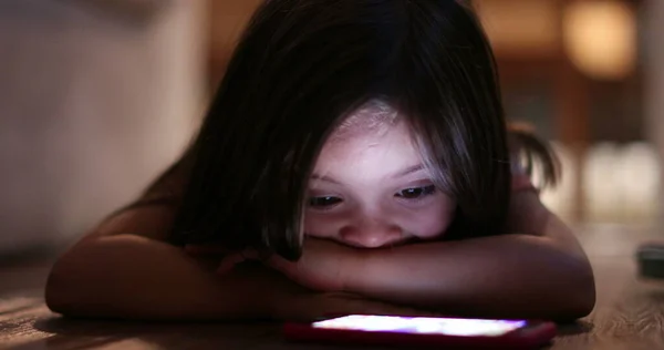 Cute Little Girl Watching Media Cellphone Device Night — Foto de Stock