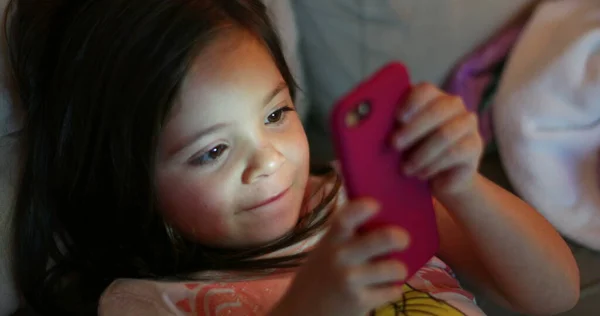 Child Using Smartphone Device Night Little Girl Holding Cellphone Evening — Zdjęcie stockowe