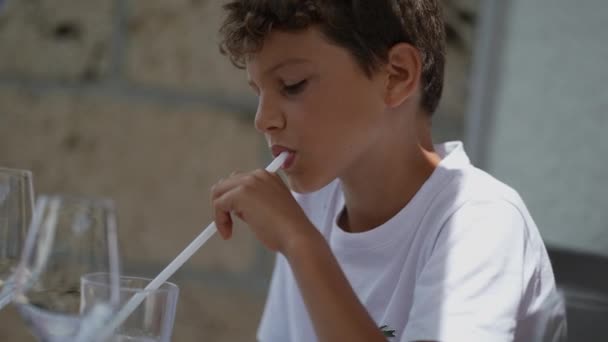 Young Boy Drinking Straw Seated Restaurant — Stok video