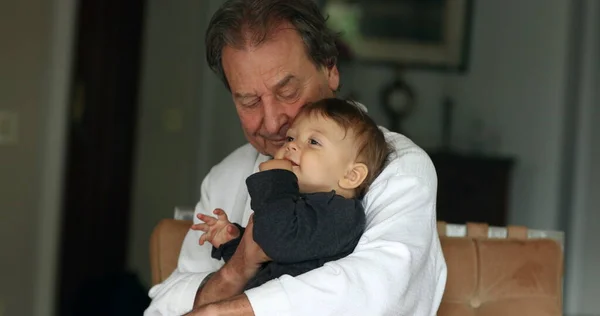Grandfather Holding Baby Grandson Casual Candid Generation Relationship Indoors — Fotografia de Stock