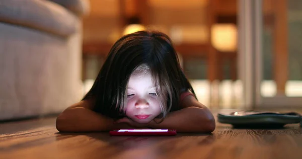 Little Girl Lying Floor Home Looking Smartphone Screen Cellphone Light — Foto de Stock