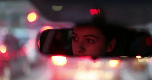 woman rearview mirror stuck in traffic