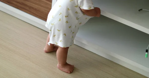 Baby Supporting Himself Home Furniture Exploring Living Room — 스톡 사진