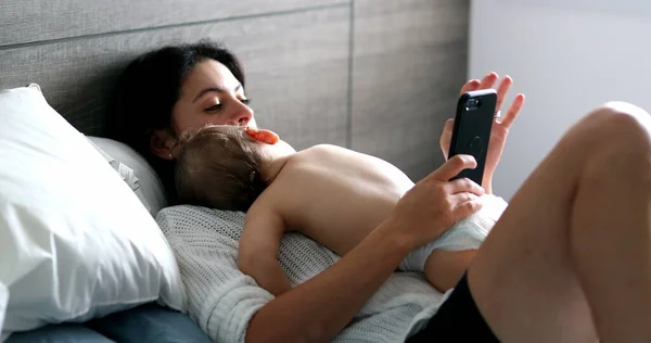 Casual Mother Looking Cellphone Baby Napping Bedroom Infant Asleep Mom — 스톡 사진