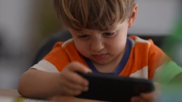 Annoyed Little Boy Using Phone Upset Child Holding Cellphone — Stock video