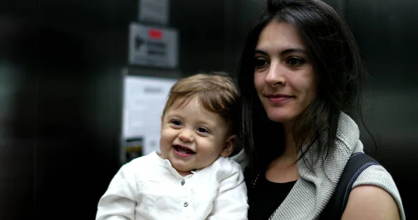 Playful Mother Holding Baby Infant Insidde Elevator Interaction Mirror — Zdjęcie stockowe