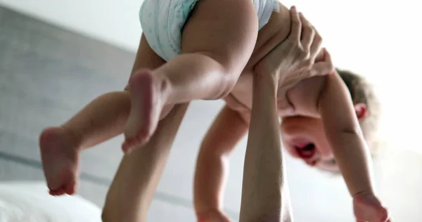 Parent Lifting Baby Air Bedroom Playful Candid Mother Lifting Infant — 스톡 사진
