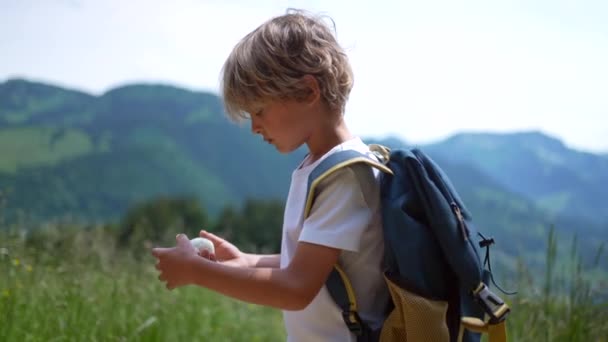 Child Hikding Eating Hard Boiled Egg While Trekking Kid Snacking — Stock Video