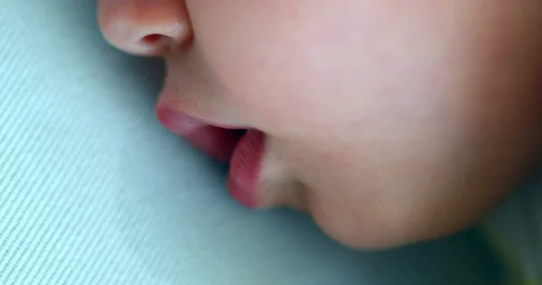 Baby macro close-up mouth drooling napping