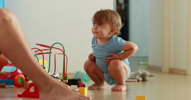 Baby paying attention, one year old infant toddler at home