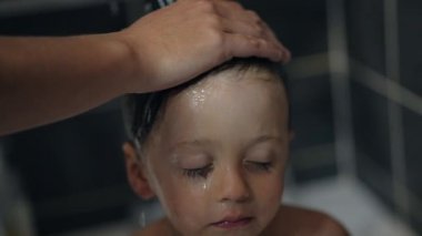 Parent bathing child hair. cleaning little boy, washing toddler