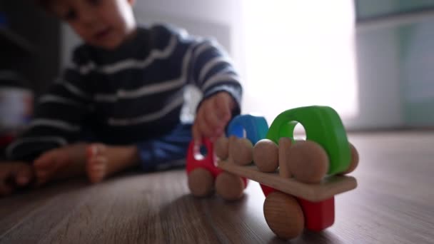 Little Boy Playing Toys Room Himself — Stockvideo