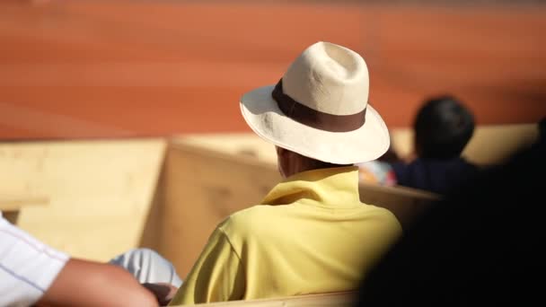 Person Wearing Panama Hat Sitting Audience Seat Watching Sport Game — Stock Video