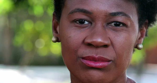 African woman close-up face looking at camera