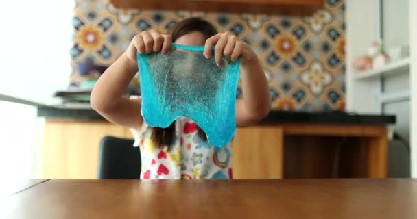 Little Girl Playing Slimy Plasticine Creating Bubble Blue Slime — Stock video