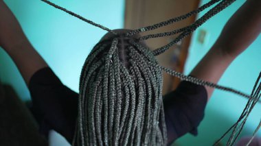A black latina girl with box braids hairstyle