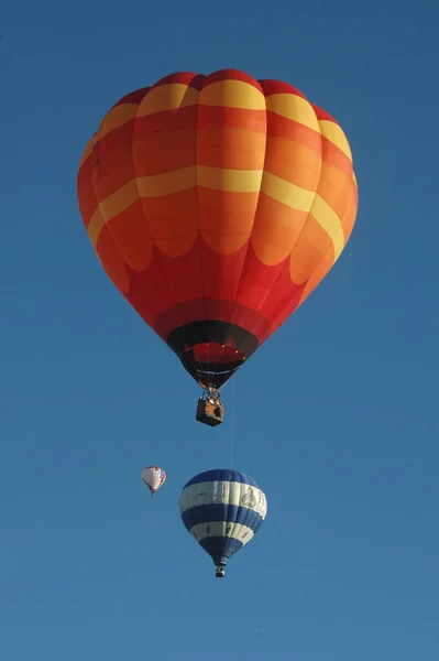 Balloons Launching Bright Blue Sky — Zdjęcie stockowe